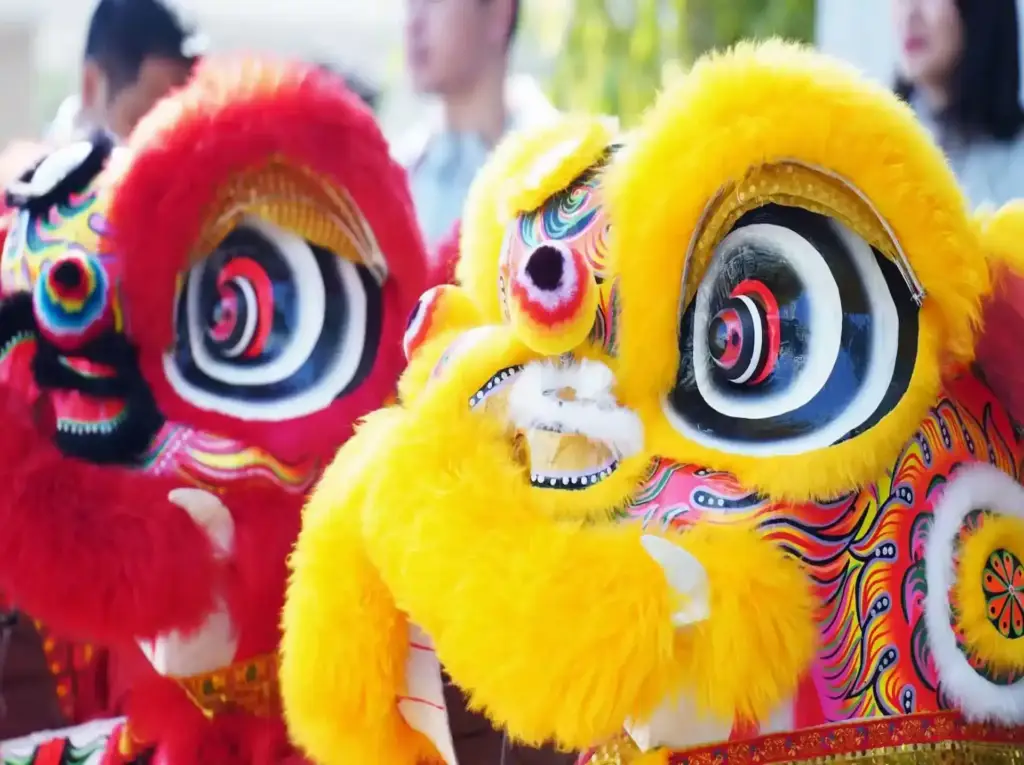 Dynamic red and yellow lion dance figures at Gaia in Love's reopening ceremony, symbolizing prosperity and the brand's ambition to lead the best sec toys industry globally.