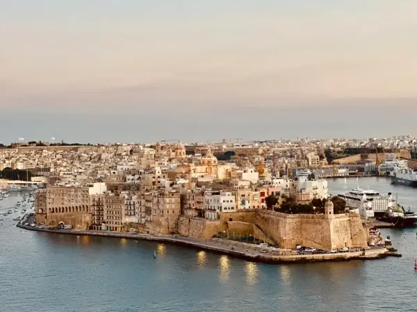 Aerial view of historic waterfront buildings and harbour in Valletta, Malta at sunset, used on the Gaia (Malta) B2B sex toy manufacturer website.